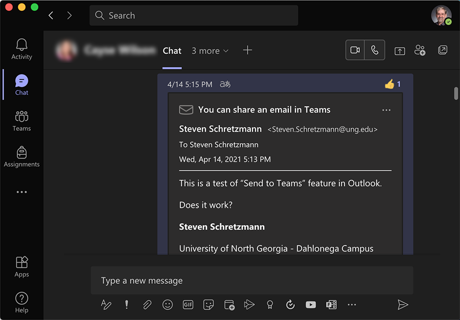 Teams chat page with a short email added from Outlook. A thumbs up emoji is in the right top corner