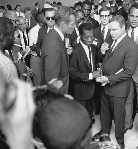 Author James Baldwin with actors Marlon Brando and Charlton Heston
